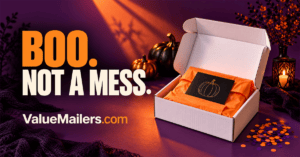 A clean Halloween unboxing with a white mailer box, a simple orange pumpkin card and neatly protected products.